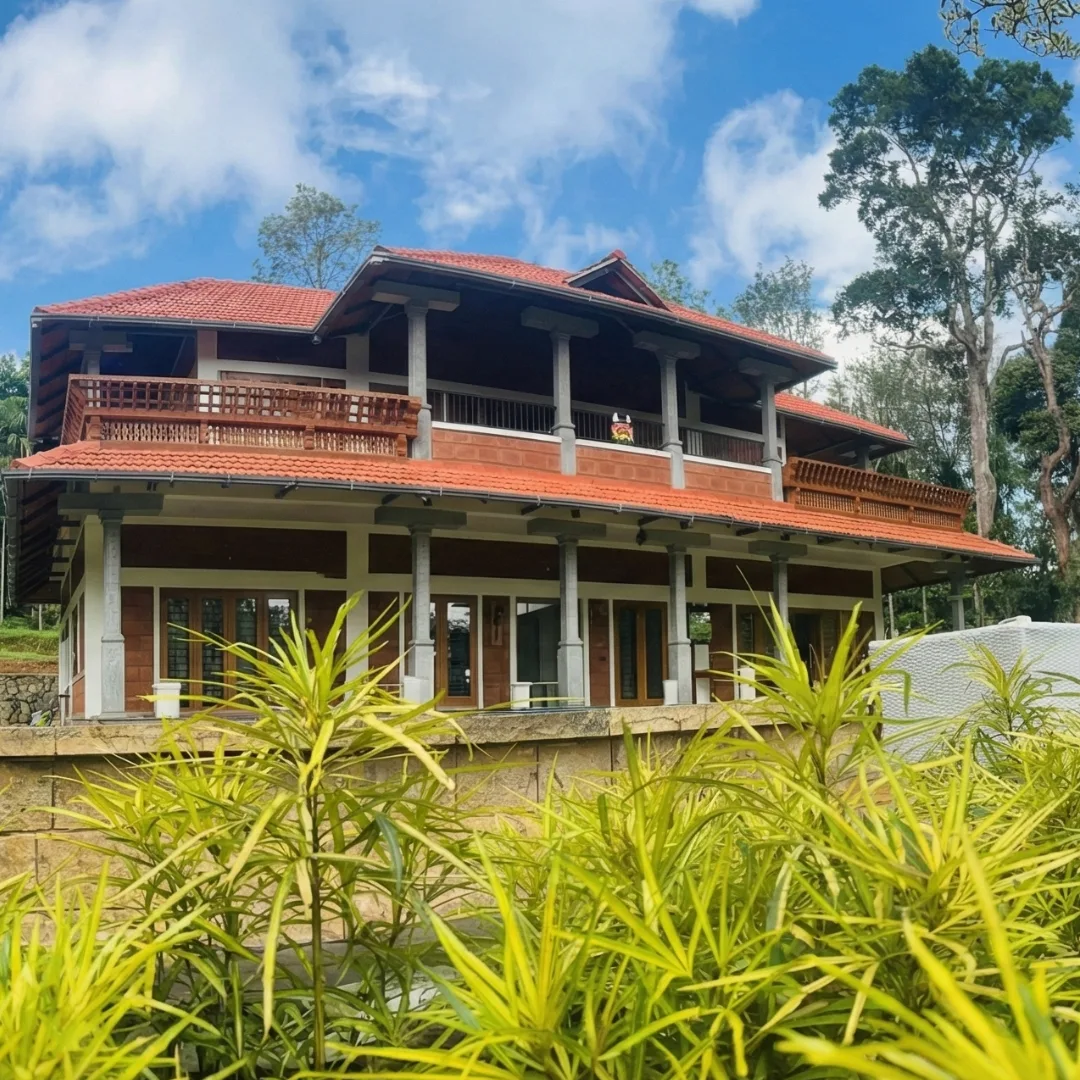 Exterior view of the private villa surrounded by coffee estate greenery in Coorg