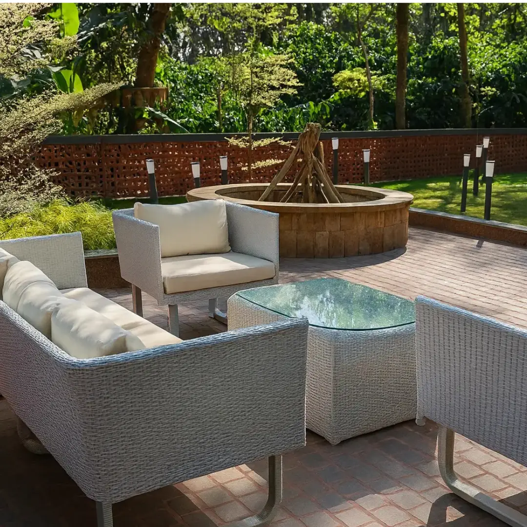 Outdoor seating area overlooking the coffee estate greenery in Coorg