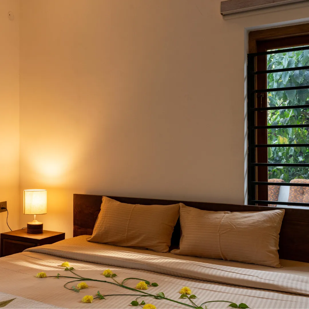 Comfortable bedroom with views of the natural surroundings in Coorg