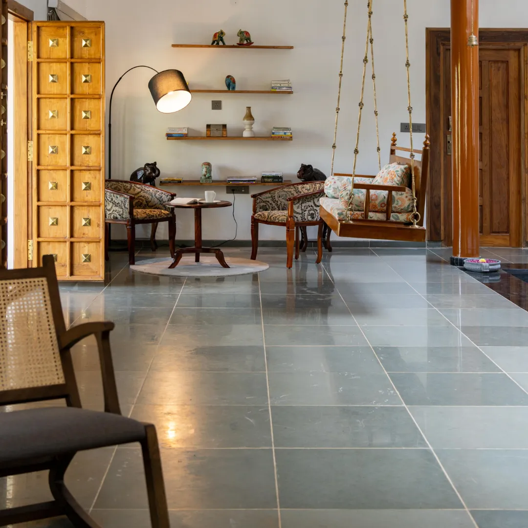 Indoor seating and relaxation area inside the Coorg villa