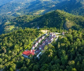 Aerial view of Mirth Resorts & Residences in Kanthalloor, Kerala surrounded by lush green hills